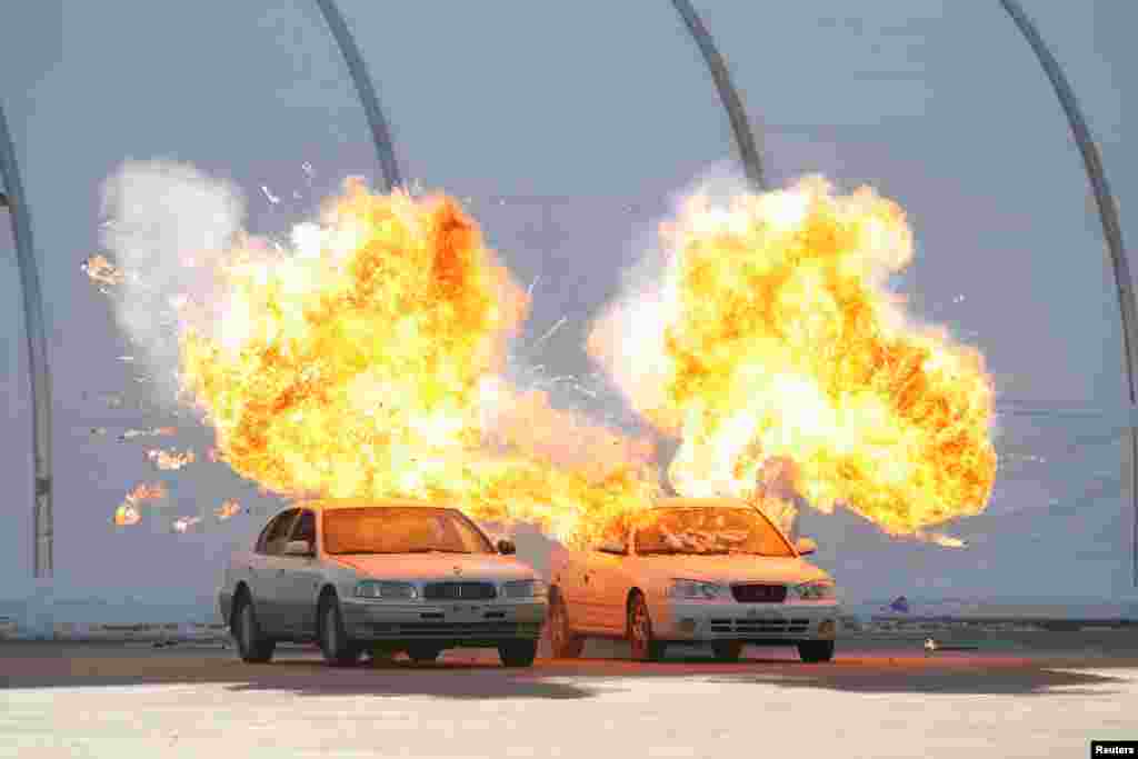 Vehicles explode during a security drill ahead of the 2018 Pyeongchang Winter Olympic Games at the Olympic Stadium, venue for the opening and closing ceremony in Pyeongchang, South Korea.