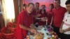 FILE - Leland Scott celebrates his birthday with his students at the Bajid Kandall 2 Yazidi refugee camp in Iraqi Kurdistan region, May 17, 2016.
