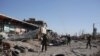 FILE - Kurdish peshmerga fighters fire into the the air while celebrating the retaking of of Sinjar, northern Iraq, Nov. 13, 2015. 