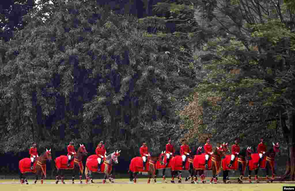 A mounted honor guard takes part in the welcoming ceremony for Brunei's Sultan Hassanal Bolkiah at the palace in Bogor, south of Jakarta, Indonesia.