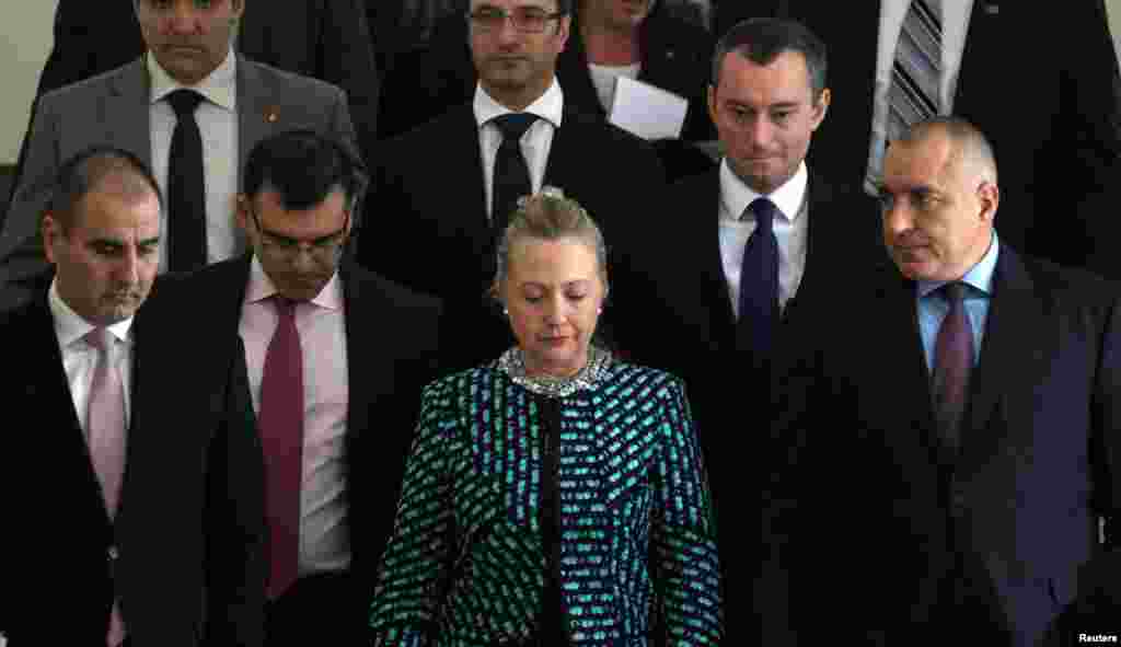 Clinton walks with Bulgaria's Prime Minister Boiko Borisov (R) and members of his cabinet before a news conference in Sofia, February 5, 2012.