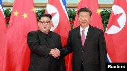 金正恩与习近平2018年5月在大连会面（路透社转载朝鲜中央社照片）
