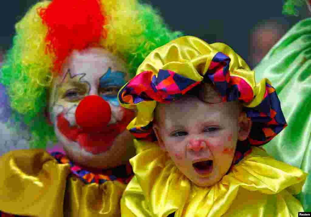 A family dressed as clowns participates in April Fools' Day revelry at the city center in Skopje, Macedonia.