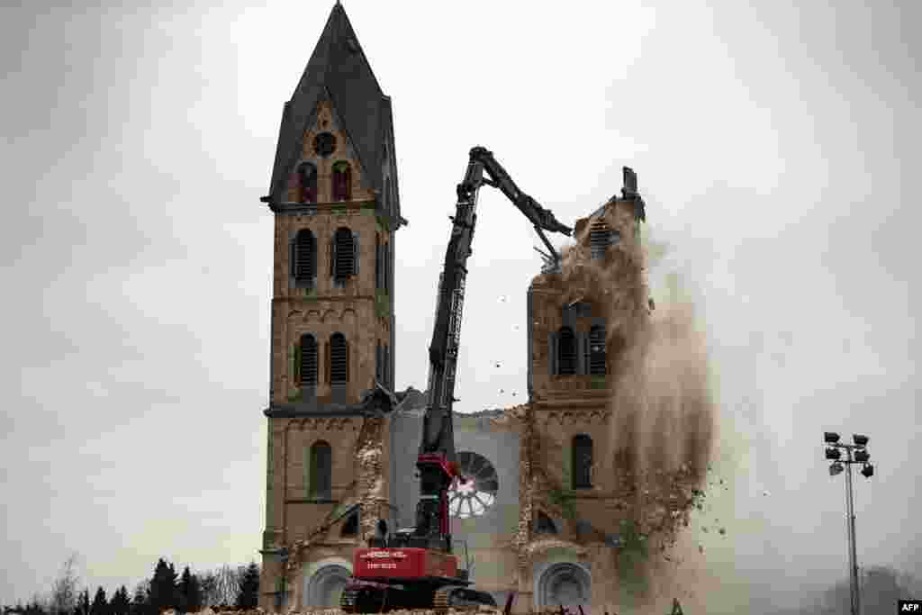The desacralized St. Lambertus church in Erkelenz-Immerath, Germany, is being demolished in order to make possible brown coal surface mining. Residents from the village of Immerath were relocated, as the area is to be developed by German energy supplier RWE Power in an extension of its Tagebau Garzweiler open-pit lignite mine.
