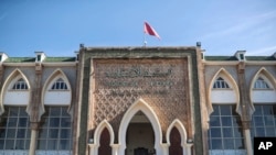 FILE - A view of a court where Moroccan rapper Gnawi faces trial on charges of insulting the police, in Sale, Morocco, Nov. 25, 2019. 
