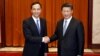 Chairman of Taiwan's ruling Nationalist Kuomintang Party (KMT) Eric Chu, also New Taipei mayor, shakes hands with China's President Xi Jinping as they pose for pictures during their meeting in Beijing, China, May 4, 2015. 