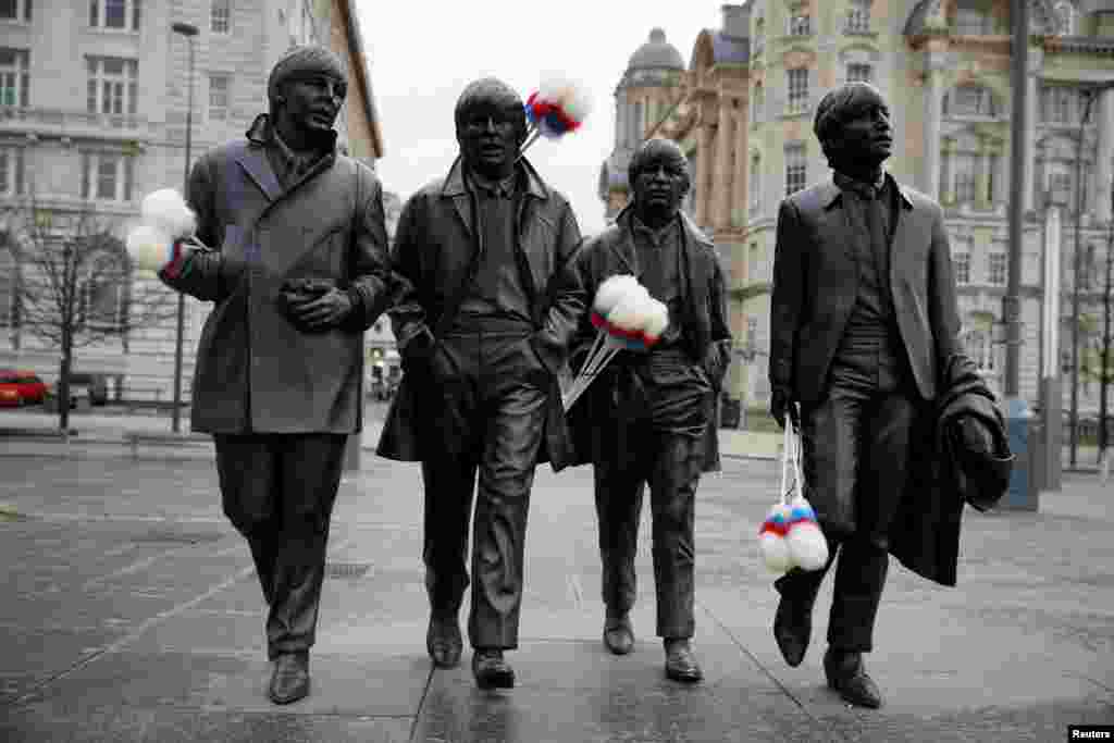 A statue of The Beatles sports "tickling sticks", comedian Ken Dodd's quintessential prop, ahead of Dodd's funeral in his home town of Liverpool, Britain.