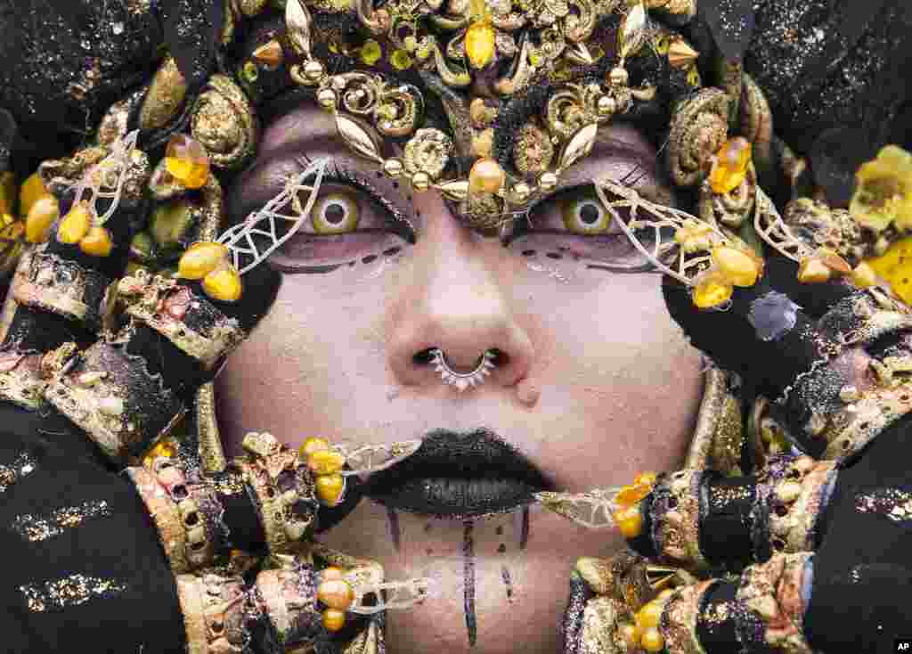 A cosplayer dressed in a fantasy costume performs during the Manga-Comic-Convention at the Leipzig International Book Fair in Leipzig, Germany, March 17, 2018.