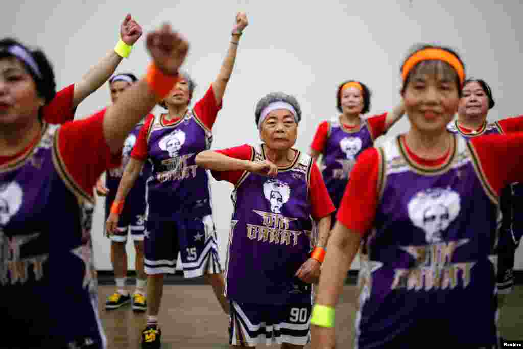 Wang-Chen Bi-Jin, 91, a member of the "Six Carat" elderly Hip Hop dance group, reacts during dress rehearsal in Taichung, Taiwan.