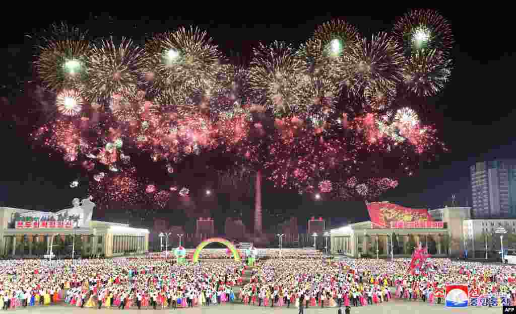 Young students celebrate the birthday of their country's founder and Eternal President Kim Il Sung, at Kim Il Sung Square in Pyongyang, in this photo taken April 15, 2021, and released from North Korea's official Korean Central News Agency on April 16.