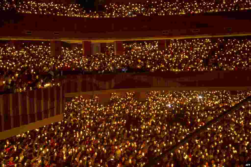 Christians attend Christmas Eve Mass at a stadium in Surabaya, Indonesia's second largest city, Dec. 24, 2017.