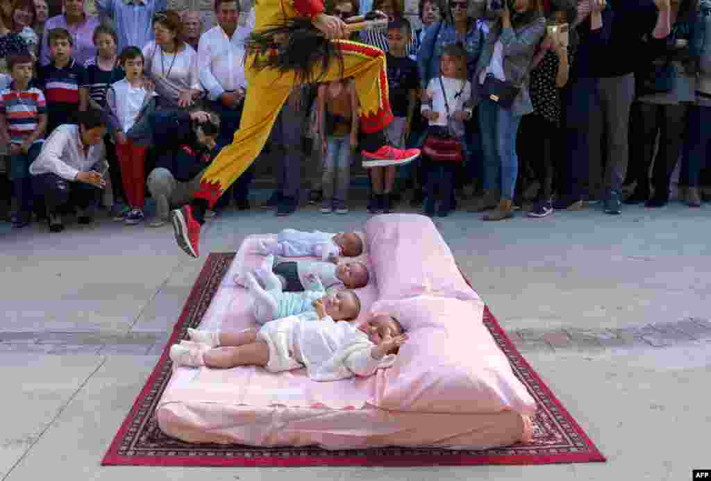 The 'Colacho' (man representing the devil) jumps over babies during 'El salto del Colacho', the baby jumping festival in the village of Castrillo de Murcia, near Burgos, Spain, June 3, 2018.