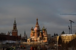 A sun ray illuminates St. Basil's Cathedral on Red Square during a cold winter day in Moscow, Russia, Jan. 11, 2019.