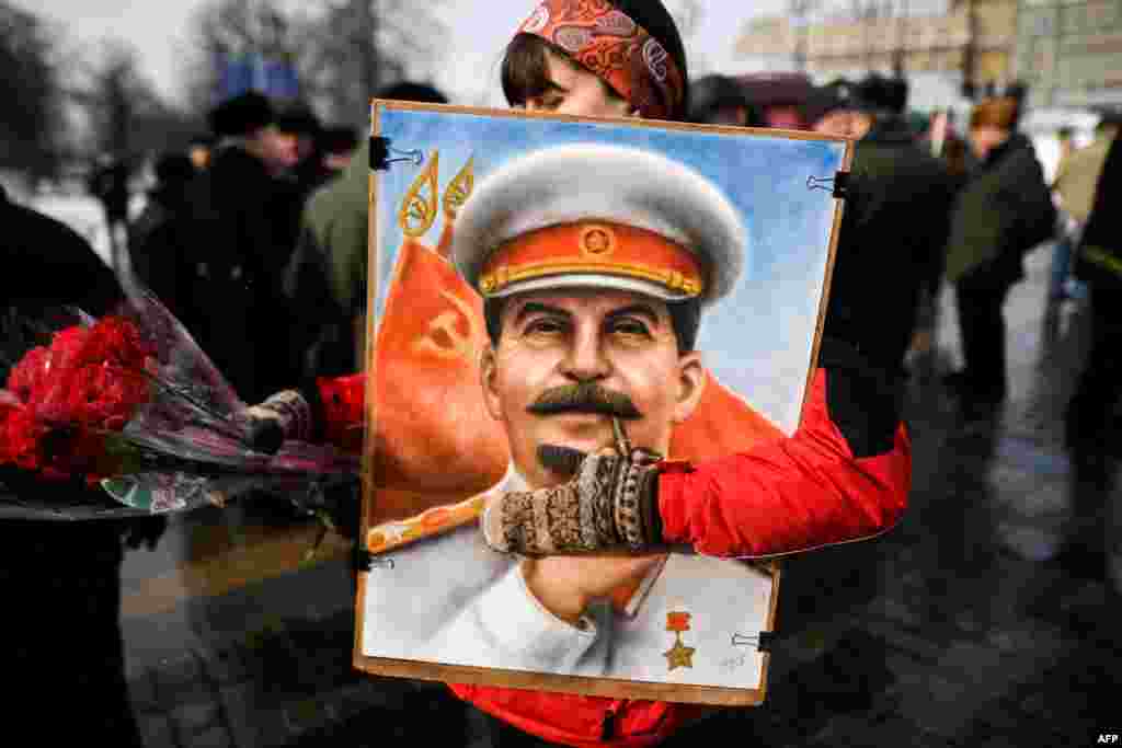 Russian Communist party supporters attend a memorial ceremony to mark the 65th anniversary of Soviet leader Joseph Stalin's death on Red Square in Moscow.