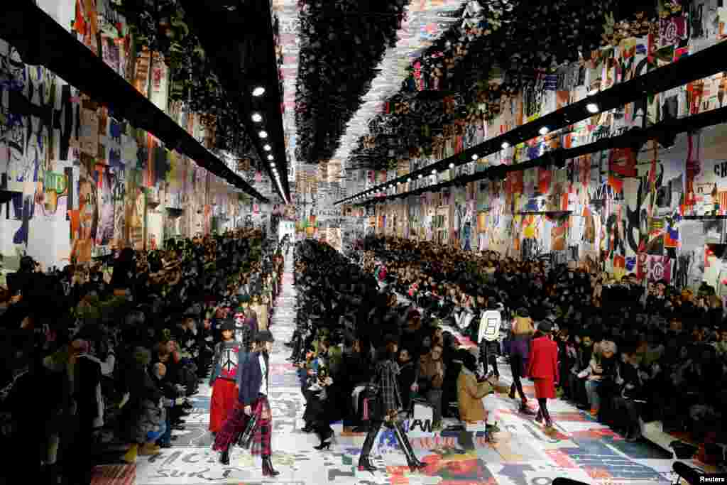 Models present creations by designer Maria Grazia Chiuri as part of her Autumn/Winter 2018-2019 women&#39;s ready-to-wear collection show for fashion house Dior during Fashion Week in Paris, France.