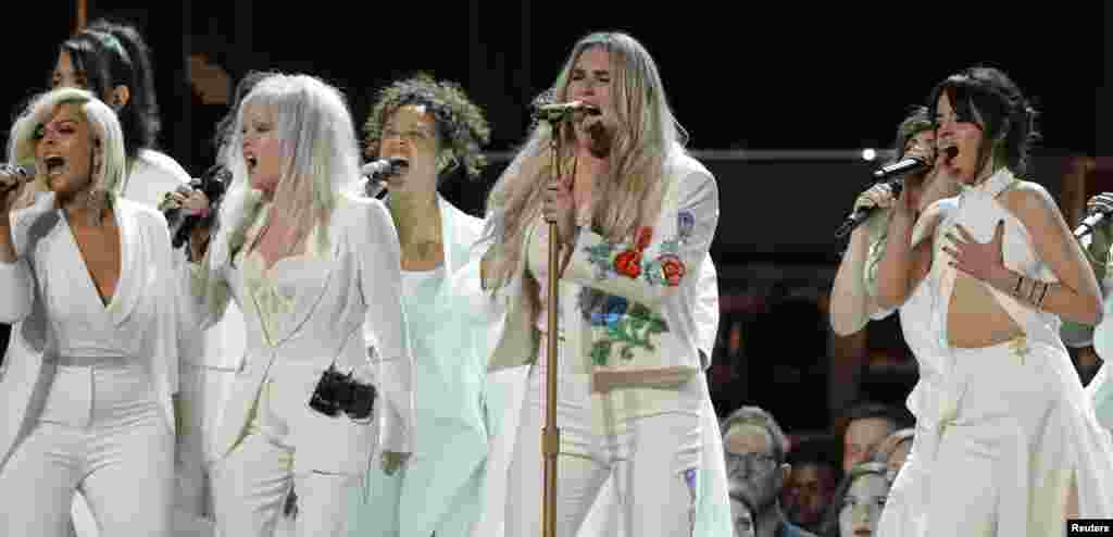 Kesha (2nd from R) performs "Praying" with Bebe Rexha (L), Cyndi Lauper and Camila Cabello (R) during the 60th Annual Grammy Awards show in New York, Jan. 28, 2018.