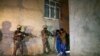 Turkish security forces apprehend a group of migrants in an operation aimed at stemming the recent influx of migration, mainly coming from Afghanistan, in the area at the border province of Van, Turkey, Aug. 21, 2021.