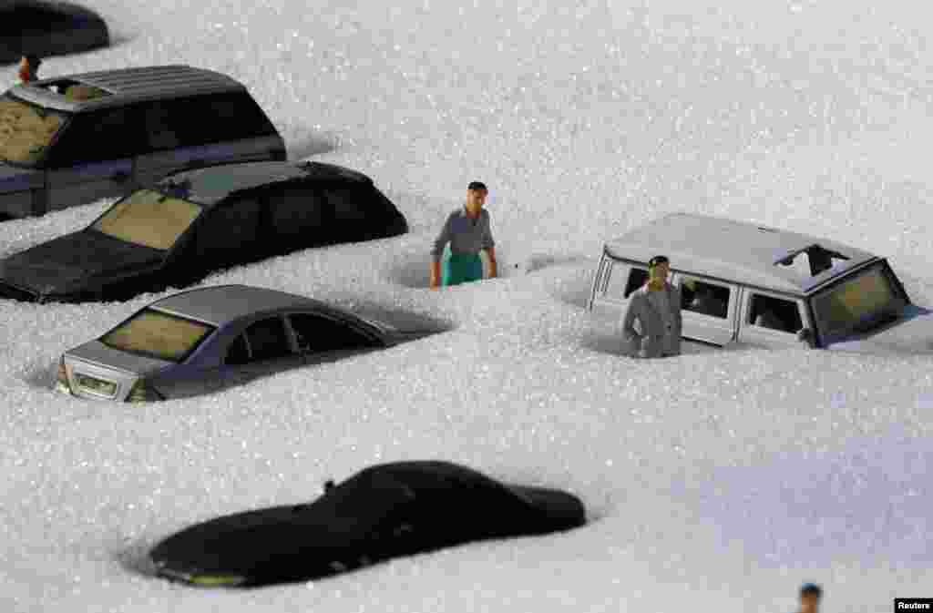 Snow covered figures are pictured at a local park of miniatures in Bakhchisaray, Crimea, Feb. 23, 2021.