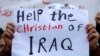 An Iraqi Christian who lives in Lebanon holds a placard during a sit-in, in front of the United Nations Headquarters demanding speeding up their immigration cases in Beirut, Lebanon, Feb. 13, 2017.