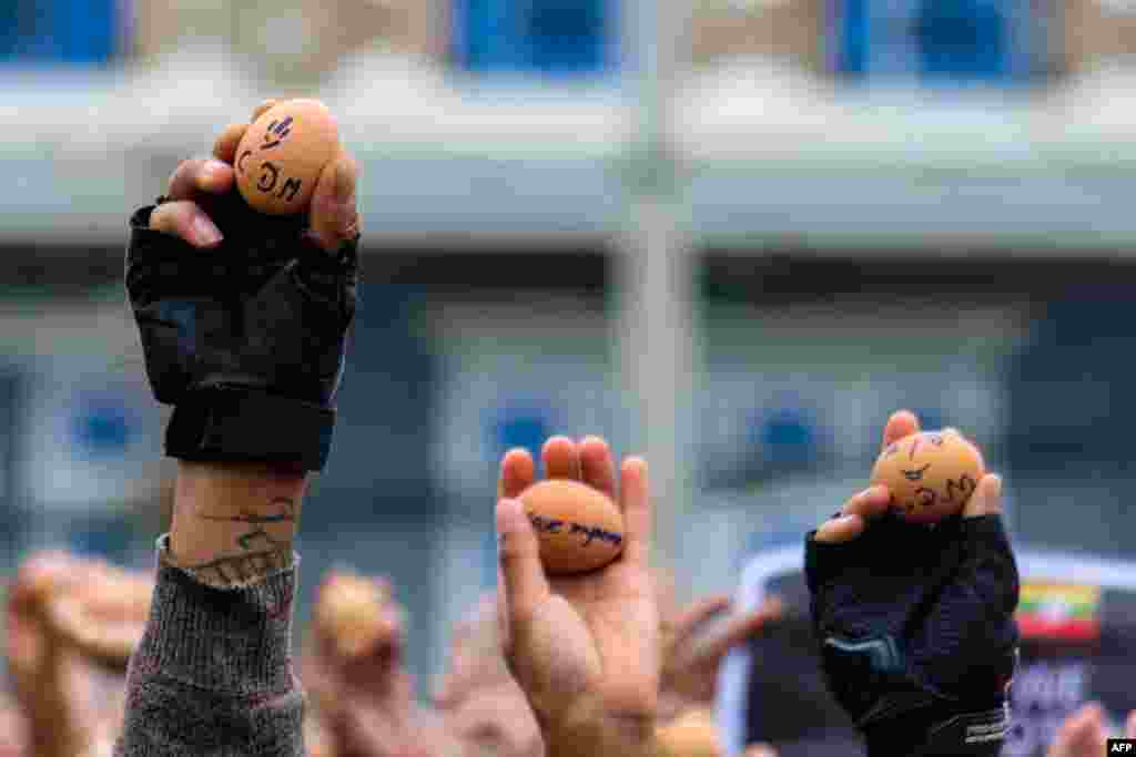 Protesters holding eggs with messages to coincide with Easter Sunday during a demonstration against the military coup in Taunggyi in Myanmar's Shan state. (Handout / Anonymous)