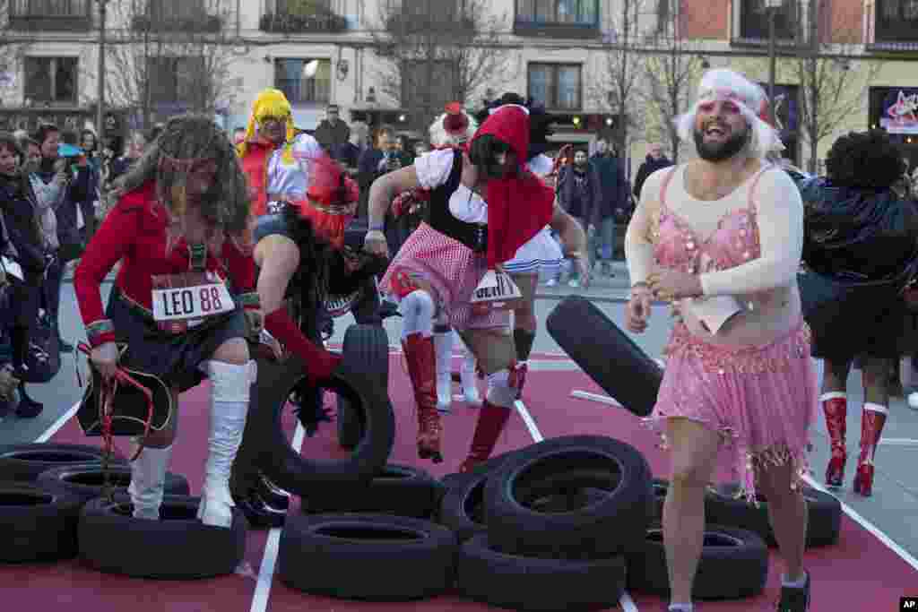 Competitors take part in a men's high heels race in Madrid, Spain.