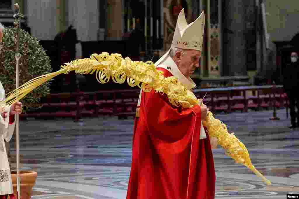 Pope Francis holds a Mass on Palm Sunday, amid COVID-19 restrictions in St. Peter's Basilica at the Vatican.