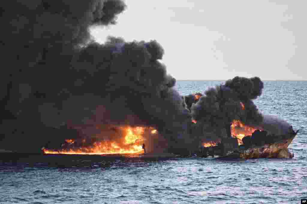 In this photo provided by China's Ministry of Transport, the burning Iranian oil tanker Sanchi is seen partially sunk in the East China Sea off the eastern coast of China, Jan. 14, 2018.