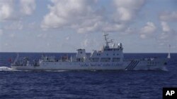 日本海上保安厅公布的照片显示中国海监-51号2012年9月14日晨在离争议岛屿大约24公里的水域巡弋。