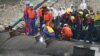 Rescue workers gather at the capsized Eastern Star in the Jianli section of the Yangtze River in China's Hubei province. The government, which arranged a media trip to the site, has pledged 'no cover-up' of an investigation.