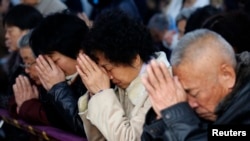 中国天津一处地下天主教会的周末弥撒（2013年11月资料照）