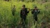 Rebel soldiers of Myanmar National Democratic Alliance Army (MNDAA) patrol near a military base in Kokang region, March 10, 2015. Myanmar government forces have been battling rebels on the border with China since last month and China has urged Myanmar to "lower the temperature."