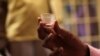 FILE - AIDS patient Michael Campbell, 58, receives his daily dose of medication at Broadway House for Continuing care, New Jersey's only specialized nursing facility for people living with HIV/AIDS, in Newark, New Jersey.