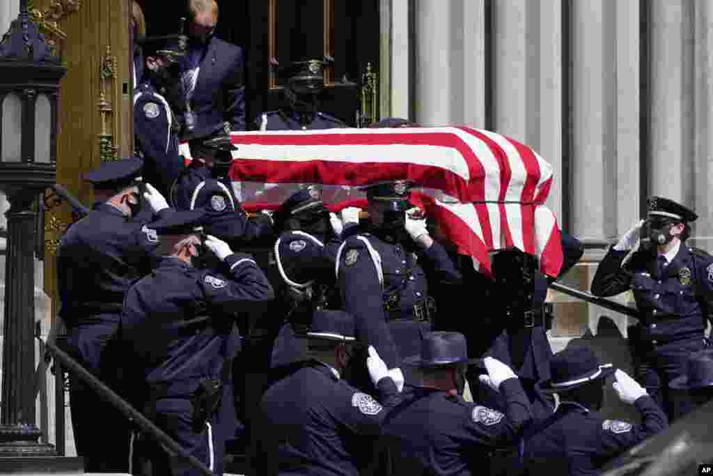 The casket carrying the body of fallen Boulder Police Department officer Eric Talley is carried by a Denver Police honor guard to a waiting hearse after a service at the Cathedral Basilica of the Immaculate Conception, March 29, 2021, in Denver, Colorado. Talley and nine other people were killed during a mass shooting at a grocery store in Boulder on March 22.