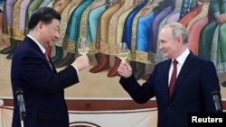 俄罗斯总统普京在克里姆林宫为中国领导人习近平的到访举办招待会。（2023年3月21日）