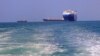 FILE - A picture taken during an organized tour by Yemen's Houthi rebels on Nov. 22, 2023, shows the Galaxy Leader cargo ship, seized by Houthi fighters two days earlier, approaching the port in the Red Sea off Yemen's province of Hodeida.