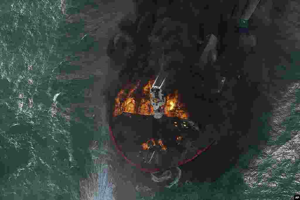 In this photo provided by Sri Lanka Air Force, smoke rises from the container vessel MV X-Press Pearl engulfed in flames off Colombo port.