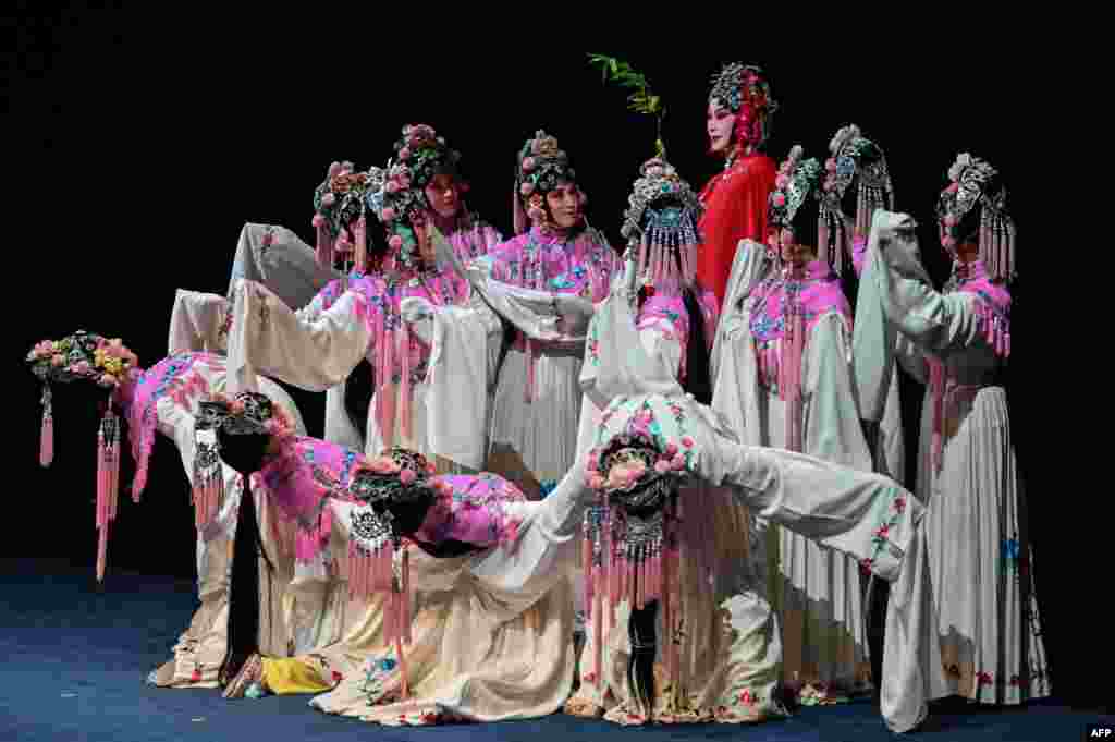 Actresses on stage during the performance of 'The Peony Pavilion', also called 'The Return of Soul' play at the Shanghai Grand Theater, in Shanghai, China, April 25, 2021.