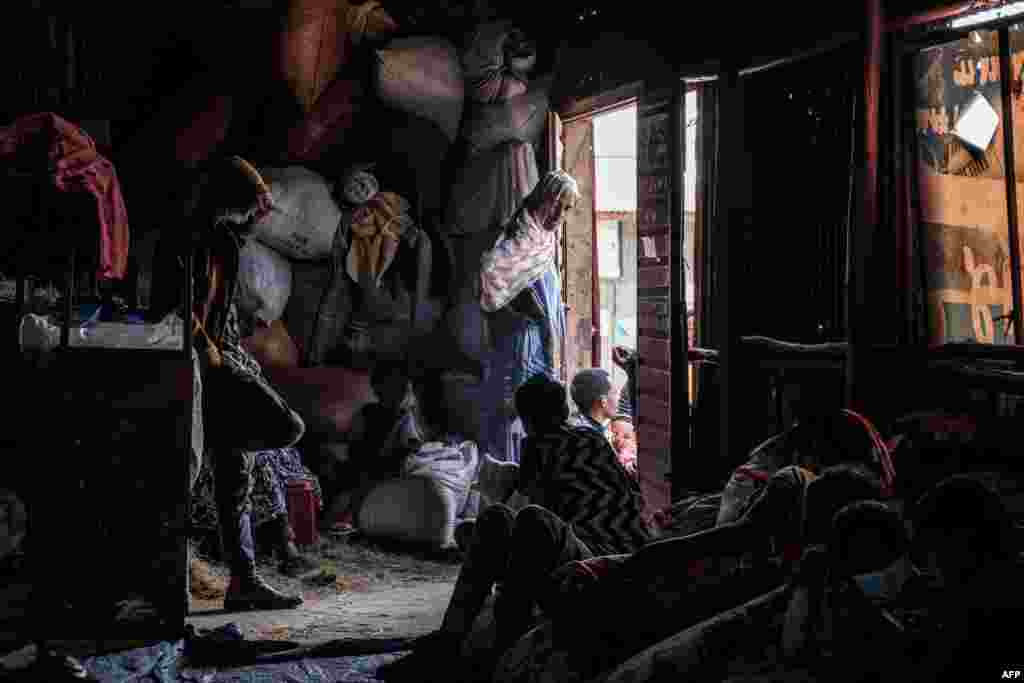 Internally displaced people take refuge at a temporary shelter in Debre Berhan, Ethiopia. More than 100 civilians died in a recent flare-up of violence in the town of Ataye that also saw the assailants torch more than 1,500 buildings. 