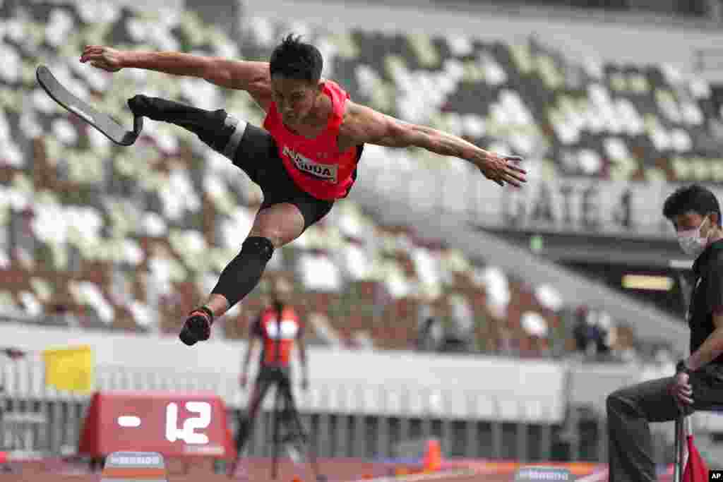 Japanese Junta Kosuda competes in the men's long jump during an athletics test event for the Tokyo 2020 Paralympics Games at National Stadium in Tokyo, Japan.