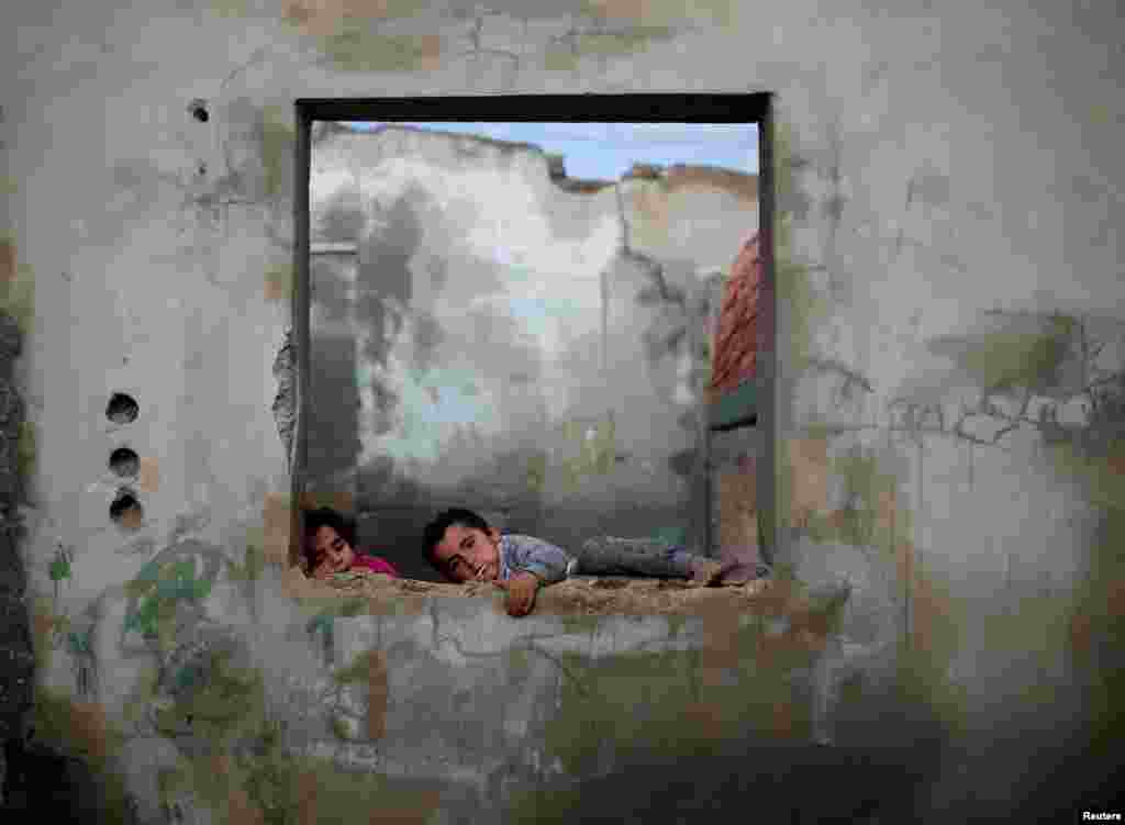 Palestinian children play at their family's house in Al-Shati refugee camp in Gaza City.