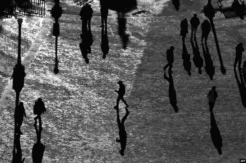 People walk at Narino Square in Pasto, Colombia.