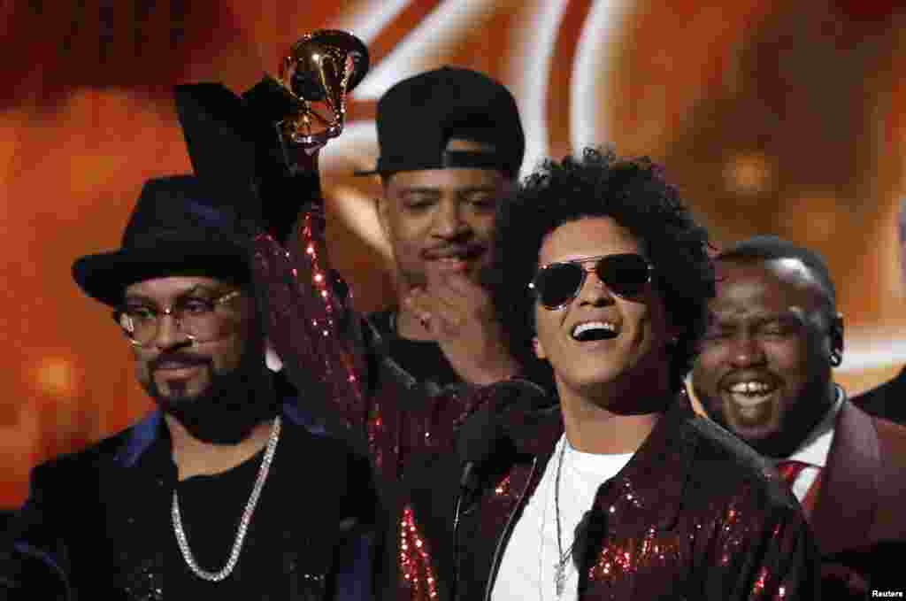 Bruno Mars accepts the Grammy for album of the year for "24K Magic" during the 60th Annual Grammy Awards show in New York, Jan. 28, 2018.