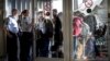 Migrants arrive at Rodby in Denmark, as Danish police guide them into a building at the harbor, Sept. 8, 2015.