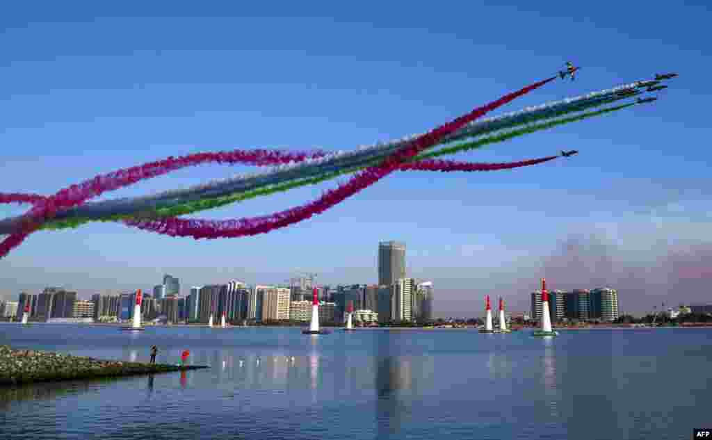 The United Arab Emirates' Al-Fursan (The Knights) National Aerobatic Team performs with smoke with the colors of the UAE flag, during the 2018 Red Bull Air Race World Championship in the Emirati capital Abu Dhabi, Feb. 3, 2018.
