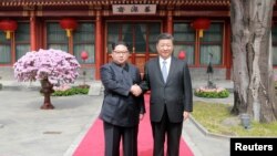 中国领导人习近平在北京会见朝鲜领导人金正恩（2018年3月路透社）