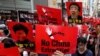 FILE - Demonstrators hold signs protesting an extradition bill during a rally in Hong Kong, June 9, 2019.