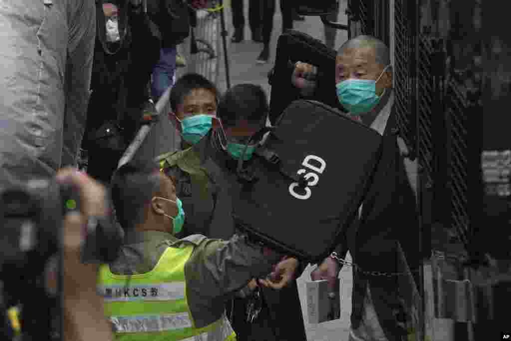 Democracy advocate Jimmy Lai, right, arrives at Hong Kong's Court of Final Appeal.