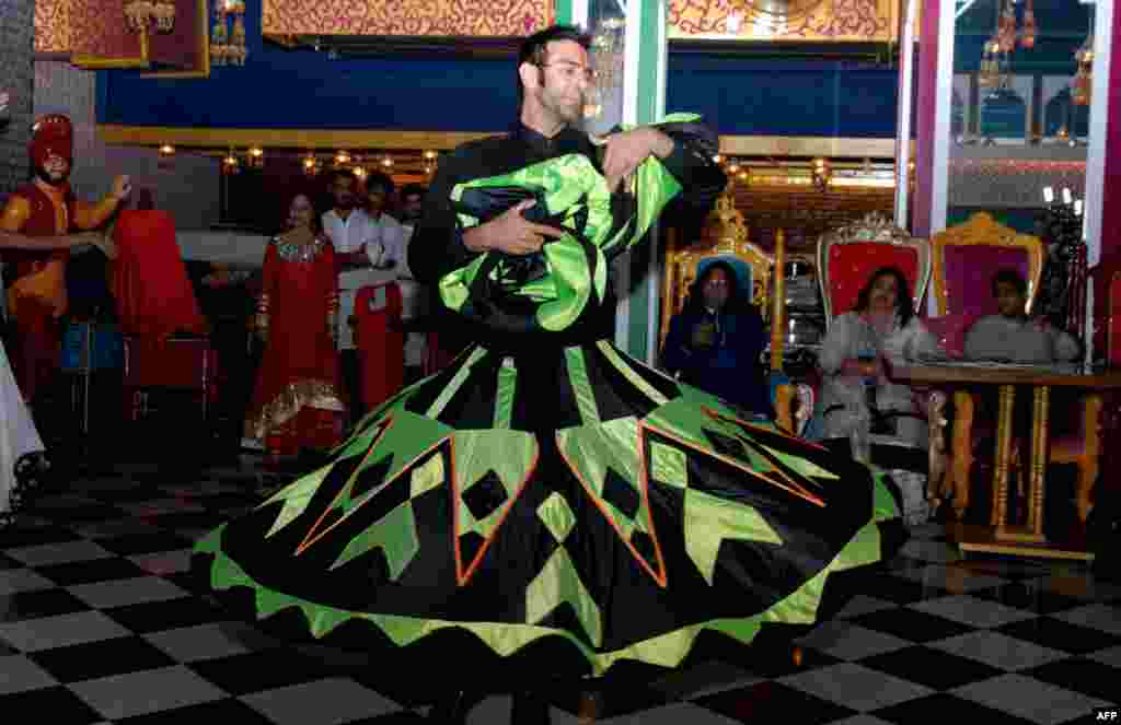 Indian Bollywood choreographer Sandip Soparkar dances during the launch of the cover page of the 'BE Publication Magazine' in Mumbai.