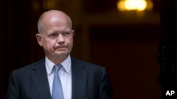 2013年8月28日英国外交大臣威廉·黑格在伦敦唐宁街召开国家安全会议