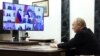 In this photograph distributed by the Russian state agency Sputnik, President Vladimir Putin holds a meeting on measures taken after the massacre in the Crocus City Hall. In the aftermath of the attack, Putin tried to tie the gunmen to Ukraine, which Kyiv flatly denied.